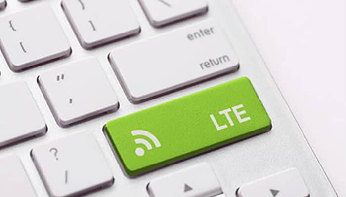 Geyey | tycoonstory media A keyboard with a green'LTE' key, symbolizing the integration of local network connectivity with devices for faster internet access.