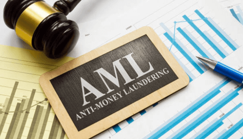 FinTech Startups A gavel placed on financial documents with AML (Anti-Money Laundering) displayed, representing the legal and compliance aspects of FinTech startups.