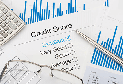 Good credit score-tycoonstory | tycoonstory media A high-contrast, black-and-white close-up of a calculator and a pen resting on top of detailed financial spreadsheets and data charts.