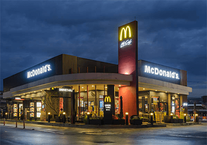 Best franchises A mcdonald's franchise store illuminated at night, representing a successful example of the franchise model in business