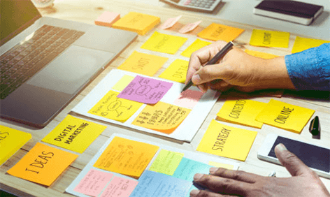 Pr agency Pr agency planning session with sticky notes, brainstorming ideas, and organizing communication strategies on a workspace.