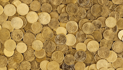 Ira company by irainvesting - tycoonstory | tycoonstory media Collection of gold coins representing long-term wealth protection and diversification offered by a gold ira company.