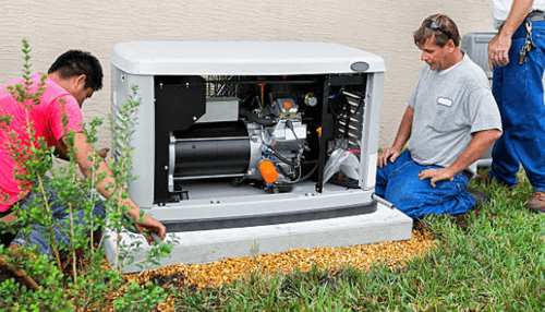 Generators installed outside a residential home during backup power system maintenance and inspection