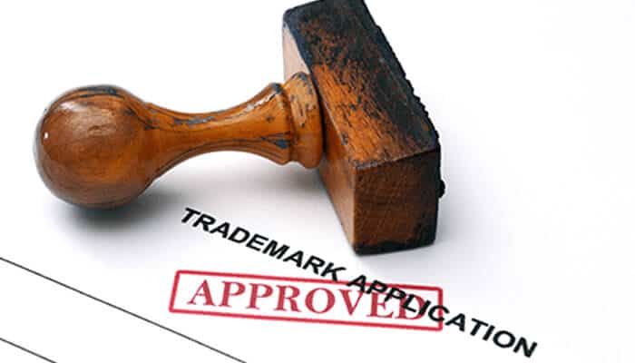 Geggwr | tycoonstory media Trademark approval document with an official stamp placed over trademark application paperwork, representing legal trademark registration and brand protection