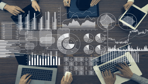 Benefits administration software Business professionals analyzing data and performance metrics using benefits administration software for efficient benefits management.