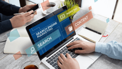 Building an effective seo strategy - tycoonstory | tycoonstory media Professionals working on search engine marketing and content strategy on a laptop, showcasing digital growth solutions for businesses.