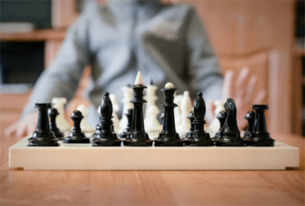 Learn from competitors-tycoonstory | tycoonstory media A chessboard symbolizing business planning and hacking strategies to outsmart competitors.