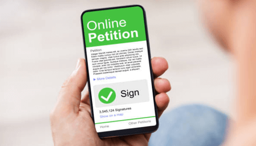 Equality Hand holding a smartphone displaying an online petition form ready to be signed.