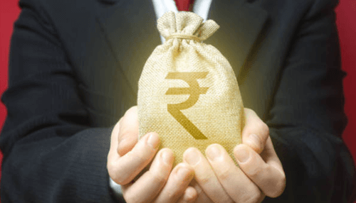 What is a fix and flip loan - tycoonstory | tycoonstory media A person holding a money bag with an indian rupee symbol, symbolizing financial transactions and fix and flip loan opportunities