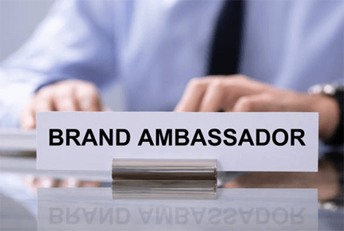 Entrepreneurial challenges Close-up of a desk nameplate reading “brand ambassador,” symbolizing entrepreneurial challenges in building brand identity and business reputation.