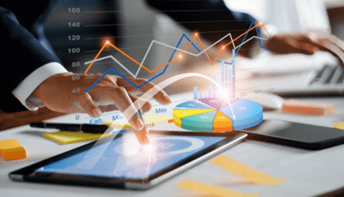 How compound finance works - tycoonstory | tycoonstory media A close-up of hands interacting with a tablet displaying financial graphs, symbolizing the use of compound finance for data-driven financial strategies