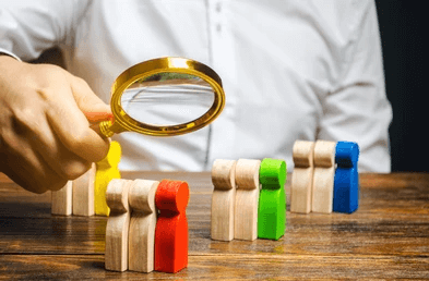 Sortlist Business professional analyzing team options with a magnifying glass, symbolizing agency selection and outsourcing via sortlist.