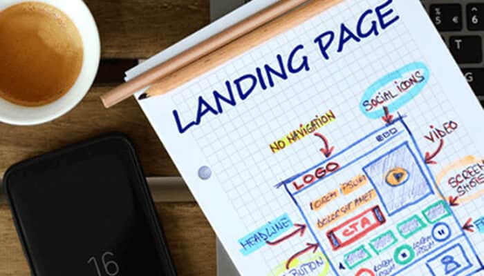 Visualize design your landing page - tycoonstory | tycoonstory media Sketch of a landing page design on paper, outlining key elements like logo, headline, social icons, and cta buttons, for create webpages with user-friendly layouts.