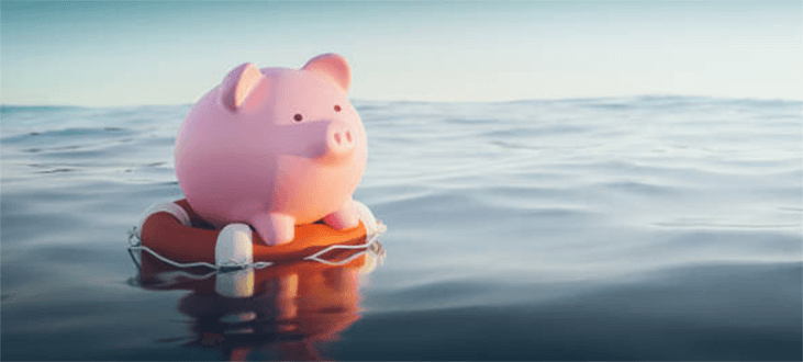 Financial risk-tycoonstory | tycoonstory media Pink piggy bank floating on a life preserver in the ocean, symbolizing business financial safety and stability