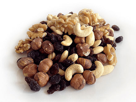 Nuts should be buy in bulk-tycoonstory | tycoonstory media Wholesale prices : a pile of mixed nuts and dried fruits including cashews, walnuts, hazelnuts, and raisins displayed on a white background.