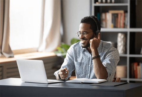 Benefits of hiring remote workers-tycoonstory | tycoonstory media Man engaged in a video call, showcasing the collaborative benefits of hiring remote employees for effective communication and team engagement.