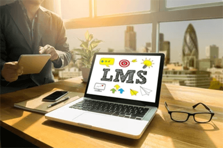 Benefits of an australian learning management systems-tycoonstory | tycoonstory media A laptop displaying an lms interface with various icons, illustrating the use of australian lms platforms for online learning and education management.