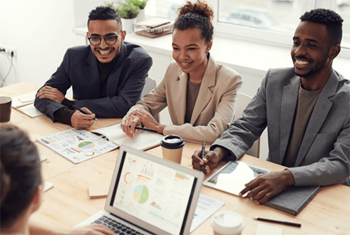 How to build a strong and efficient team-tycoonstory | tycoonstory media A diverse team of professionals collaborating in a meeting, illustrating the concept of perfect employees working together for business success.