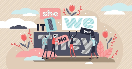 What is a preferred pronoun-tycoonstory | tycoonstory media Illustration of diverse people holding signs with different pronouns such as'she,' 'he,' 'we,' 'they,' and 'you,' surrounded by decorative flowers and clouds, emphasizing the concept of pronouns in language and identity.