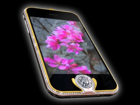 Expensive phones Diamond-studded luxury phone with gold trim and floral display, illustrating exclusive expensive phones.