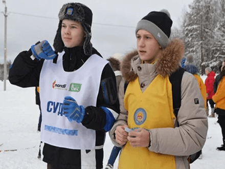 Team day ideas Group of people participating in an outdoor winter activity, showcasing fun team day ideas for bonding.