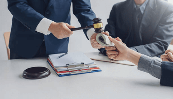 Personal injury settlements in us legal history - tycoonstory | tycoonstory media A judge handing over money to an individual during a legal proceeding, representing compensation and financial awards in personal injury settlements
