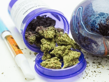 What is cbd vape oil buy cbd vape oil- tycoonstory | tycoonstory media A purple container spilling cannabis buds beside a vape pen and herbal material, depicting items often linked with cbd vape oil and related wellness products.