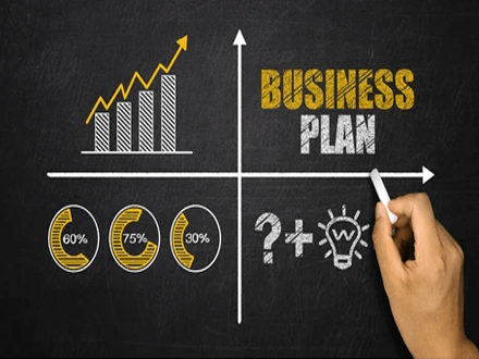 Develop a business plan Real estate entrepreneur creating a strategic business plan with growth charts and financial planning concepts