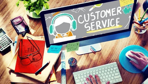 Enhances customer service Route planning depicted in an office workspace with a computer showing'CUSTOMER SERVICE,' surrounded by tools and papers for efficient delivery.