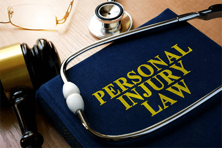 Personal Injury Accident Lawsuits Personal injury law book with a gavel, stethoscope, and glasses, representing the legal field for personal injury lawsuits.