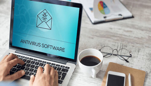 Antivirus software protection A person typing on a laptop displaying "antivirus software" with a bug-in-an-envelope icon, illustrating cybersecurity best practices often discussed by peter decaprio.