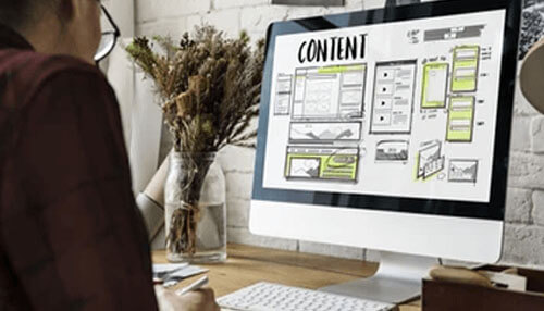 Content marketing Content marketing strategy displayed on a computer screen, showcasing a wireframe design for website layout and content planning.