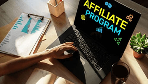Create an affiliate program Affiliate program strategy shown on a laptop screen with analytics charts and marketing icons, highlighting important tips for creating and managing a successful affiliate program.
