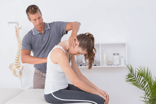 Chiropractic treatment for relieving back pain Chiropractic treatment session showing a chiropractor adjusting a patient’s neck and upper back to relieve back pain and improve spinal alignment.
