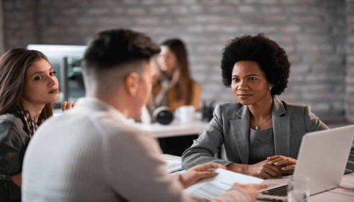 Keep an eye and an ear to your customers A professional discussion in a meeting, highlighting a creative strategy session with team members working together to brainstorm and solve business challenges.