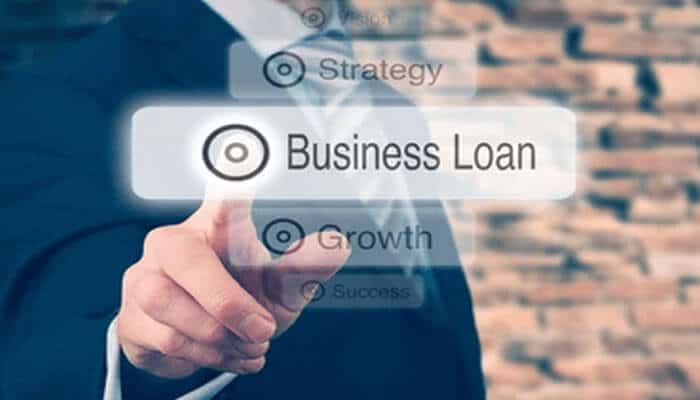 Business loan | tycoonstory media Business professional selecting the business loan option, highlighting key steps in starting a new business with financial support