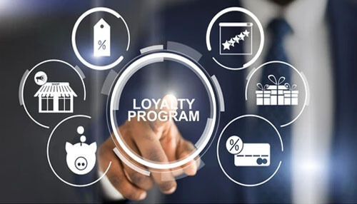Loyalty programs Digital graphic of a hand touching a loyalty program circle, related to online poker rewards.