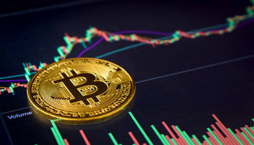 Trading A close-up of a bitcoin coin placed over a cryptocurrency trading chart, symbolizing money with cryptocurrency and its volatile market trends.