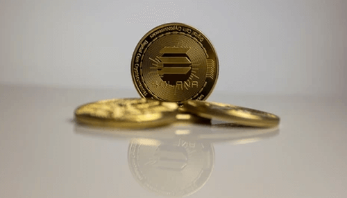 Investing in solana Solana cryptocurrency investment concept showing stacked solana coins on a reflective surface, representing the question of whether it is worth investing in solana cryptocurrency in 2022.