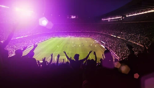 Sporting events - tycoonstory | tycoonstory media Super bowl stadium packed with fans cheering under bright lights, capturing the excitement and massive audience of the super bowl event