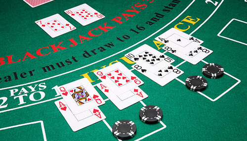 Blackjack Casino blackjack table with playing cards, poker chips, and dealer layout in a professional casino setting