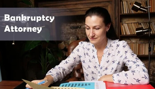 Business bankruptcy Bankruptcy: a bankruptcy attorney reviewing financial documents in a professional office setting, emphasizing legal expertise in bankruptcy cases.