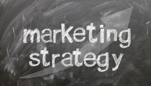 Tiktok marketing tactics Marketing strategy written on a chalkboard, symbolizing the planning and execution of tiktok marketing tactics.