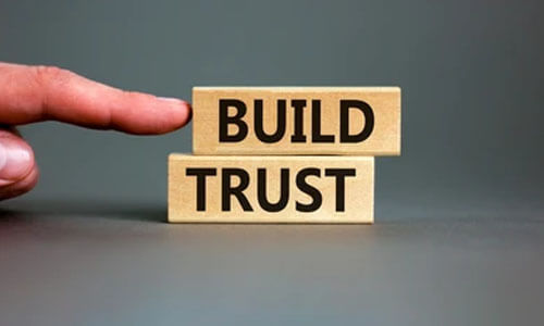 Builds trust and loyalty in markets Wooden blocks with the words'Build Trust,' representing the importance of building trust in blogging to create a loyal audience.