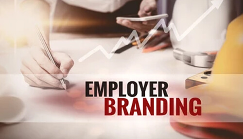 A person working on employer branding strategy with a rising graph symbolizing growth and success. Develop strong employer brand sourcing strategies