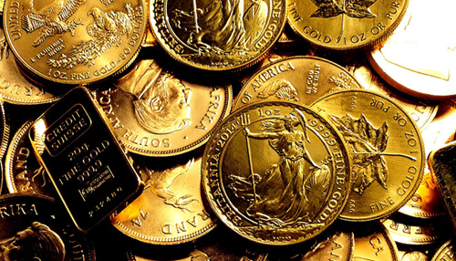 Local vs online A collection of gold coins and a gold bar, symbolizing investment opportunities and wealth management through a gold dealer.