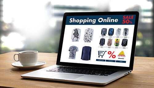 Small business ideas An online shopping website displayed on a laptop screen with a 50% sale, showcasing small business ideas in the e-commerce space and digital marketing.