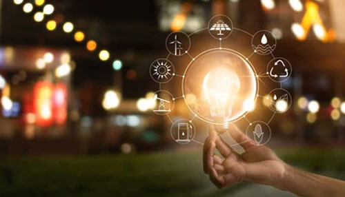 Organize your business sources with the business plan Hand holding a light bulb symbolizing business plan innovation with various sustainability icons.