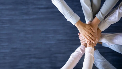 Teamworking Business team stacking hands together to show teamwork and collaboration