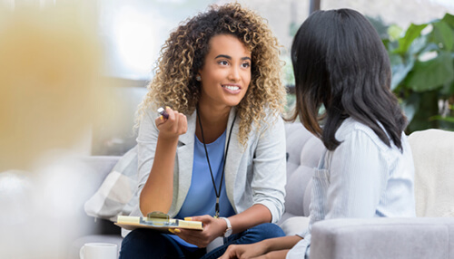 Professional discussing client needs, representing better client service in the gig economy Gig economy client service